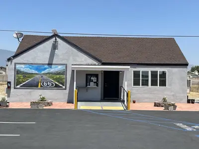 a building with a large painting on the side of it at Fontana Inn in Fontana