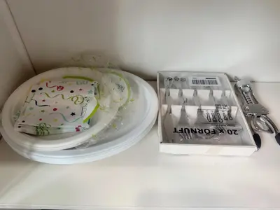 a cake sitting on a plate next to a knife at \u534e\u4eba\u533a\u82b1\u56ed\u522b\u5885 in Temple City