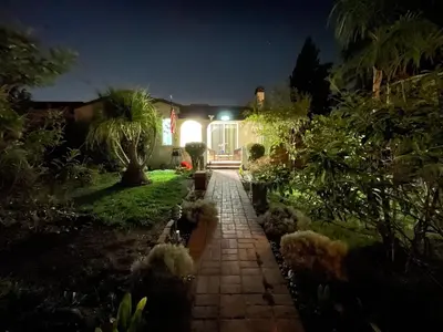 a house with a garden at night at \u534e\u4eba\u533a\u82b1\u56ed\u522b\u5885 in Temple City