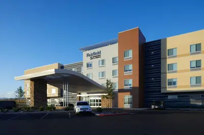 a hotel with a white truck parked in front of a building at Fairfield by Marriott Inn & Suites Palmdale West in Palmdale