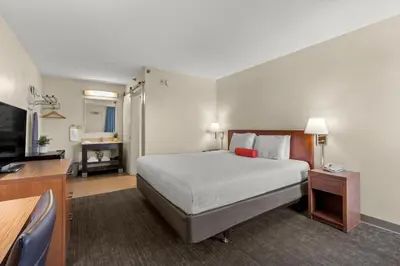 a hotel room with a bed and a television at Good Nite Inn Buena Park in Buena Park