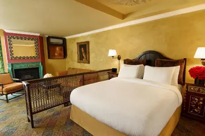 a bedroom with a large bed and a living room at Petit Ermitage in Los Angeles