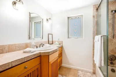 a bathroom with a sink and a shower at Seaside Getaway in Oxnard