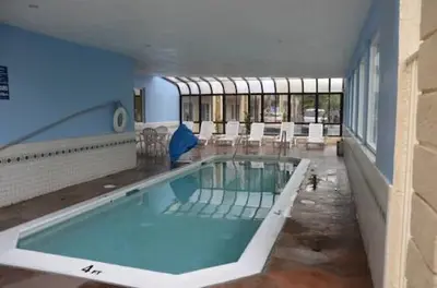 a large swimming pool in a large building at Beachside Inn in Anaheim