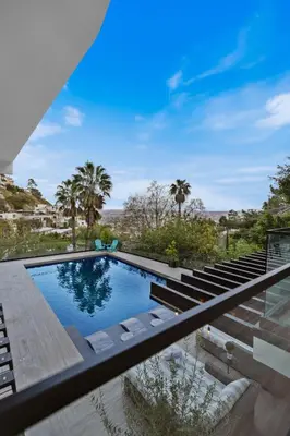 a swimming pool with a view of a house at Franklin Modern in Los Angeles