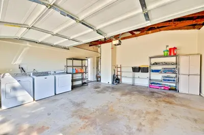 an empty garage with washers and dryers in it at Disney Getaway in Anaheim