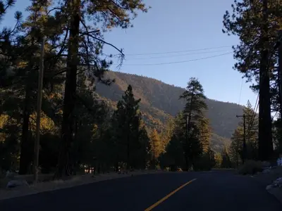 an empty road with a mountain in the background at The Old Bear BnB in Pine Mountain Club