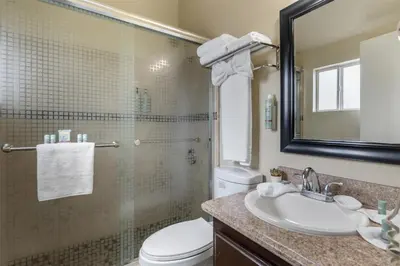 a bathroom with a sink and a toilet and a mirror at Best Western Westminster Inn in Westminster