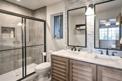 a bathroom with a toilet and a sink and a shower at Luxe Lake Arrowhead Getaway with Treetop Views! in Lake Arrowhead