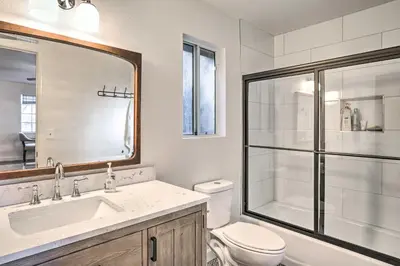 a bathroom with a toilet and a sink and a shower at Luxe Lake Arrowhead Getaway with Treetop Views! in Lake Arrowhead