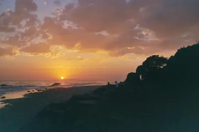 a sunset on the beach with the sun setting at Holiday Inn Express & Suites Carpinteria by IHG in Carpinteria