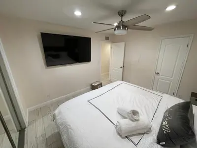 a bedroom with a bed with a towel on it at Cheerful, Beautifully Remodeled, Modern, Comfortable Home in Los Angeles