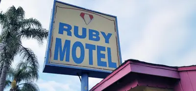 a sign for a motel on top of a building at RUBY MOTEL in Long Beach