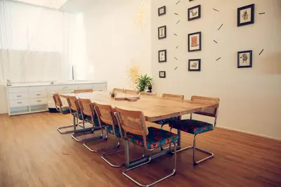 a dining room with a wooden table and chairs at STAY OPEN Venice Beach in Los Angeles