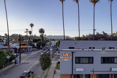 a view of a city street with a k mortgage sign on a building at La Mirage Inn - Hollywood in Los Angeles