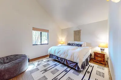 a bedroom with a bed and a couch in it at Grey Stone Fire in Running Springs