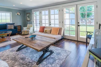 a living room with a couch and a coffee table at Le Bleu House - Newly Designed 3BR HOUSE & POOL by Topanga in Los Angeles