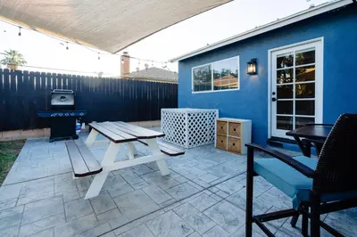 a patio with a picnic table and a grill at Le Bleu House - Newly Designed 3BR HOUSE & POOL by Topanga in Los Angeles