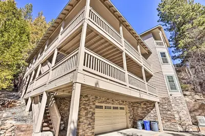 a large house with a balcony and a garage at Huge Lake Arrowhead Home with 3 Decks and Grill! in Lake Arrowhead