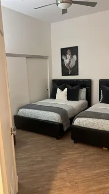 a bedroom with two beds and a ceiling fan at Exceptional Loft FREE Parking and WIFI in Los Angeles