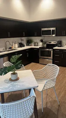 a kitchen with a table and two chairs and a plant at Exceptional Loft FREE Parking and WIFI in Los Angeles