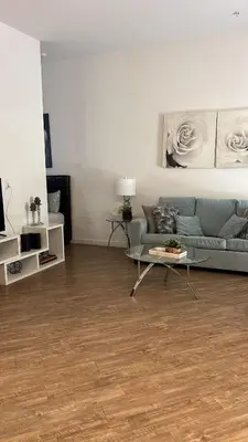 a living room with a couch and a table at Exceptional Loft FREE Parking and WIFI in Los Angeles