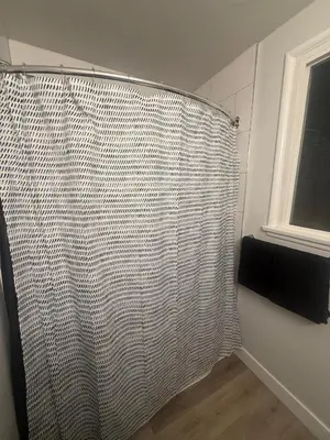 a shower curtain in a bathroom with a window at Hollywood Prime Location Walk to Hollywood Attractions Free Parking in Los Angeles
