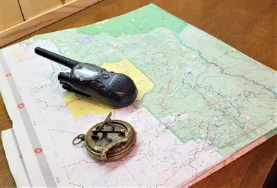a remote control and a gun on a map at Sequoia Trails, mountains, fun & relax in Ponderosa