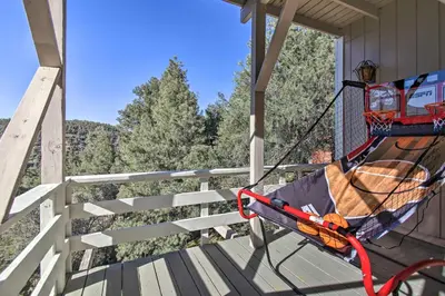 a hammock on the porch of a house at Luxe Escape with Decks, Mtn Views, Game Room! in Frazier Park