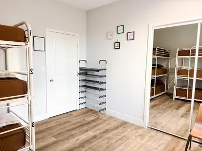 a room with bunk beds and a closet at Fruit Hostel in Los Angeles