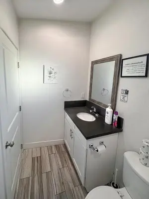 a bathroom with a sink and a toilet at Fruit Hostel in Los Angeles