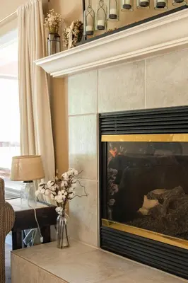 a living room with a fireplace and a table at Lazy Squirrel - Cozy Family House with Full Game Room in Kernville