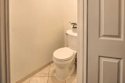 a bathroom with a toilet with a plant on top of it at 2 Mi to Griffith Park! Burbank Extended-Stay Condo in Burbank