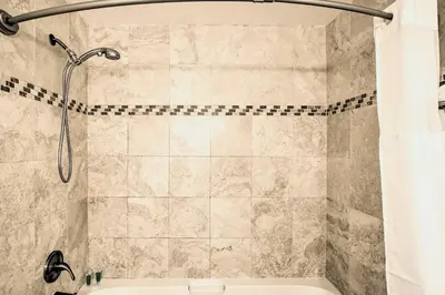 a bathroom with a shower with a shower curtain at 2 Mi to Griffith Park! Burbank Extended-Stay Condo in Burbank