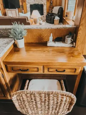 a wooden desk with a wicker chair next to a sink at Stunning LAKE VIEW Game Room Spa Walk To Village in Lake Arrowhead