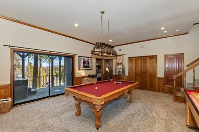 a living room with a pool table in it at Stunning LAKE VIEW Game Room Spa Walk To Village in Lake Arrowhead