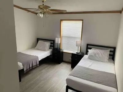 a bedroom with two beds and a ceiling fan at Views Views Views! in Wofford Heights
