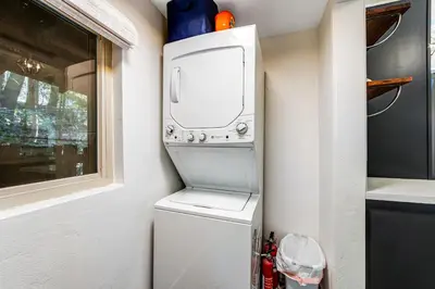 a washer and dryer in a small kitchen at Paradise in the Palisades in Lake Arrowhead
