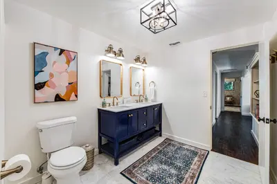 a bathroom with a blue sink and a toilet at Paradise in the Palisades in Lake Arrowhead
