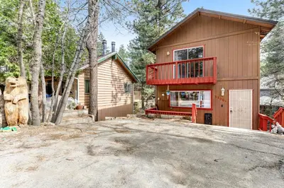a house with a balcony on the side of it at Blue Bird Beauty in Running Springs