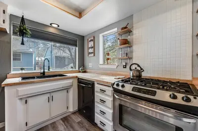 a kitchen with a stove and a sink at Blue Bird Beauty in Running Springs