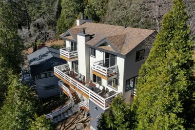 an aerial view of a house at Picturesque Cabin 2 Balconies, Walk to Lake! in Crestline