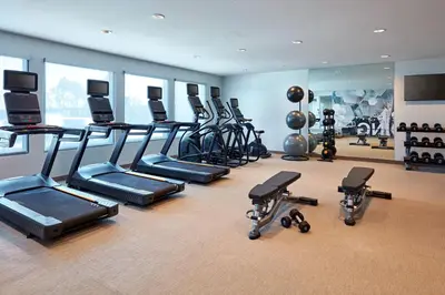 a gym with a bunch of treadms and cardio machines at SpringHill Suites by Marriott Los Angeles Downey in Downey