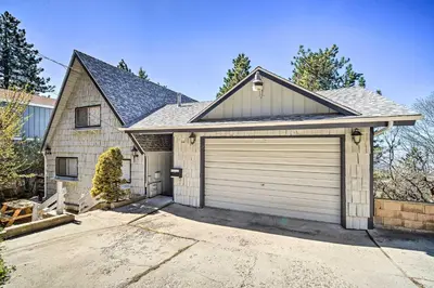 a house with a garage at Running Springs Cabin with Large Deck and View! in Running Springs