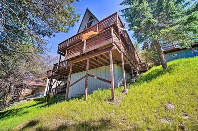 a house being constructed on top of a hill at Running Springs Cabin with Large Deck and View! in Running Springs