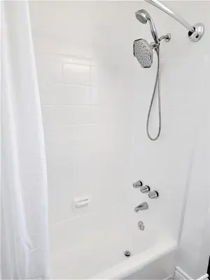 a shower with a shower head in a bathroom at Spacious Coastal Apartment in a Colorful Community - NRP22-00590 in Long Beach