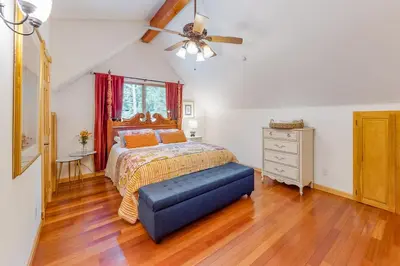 a bedroom with a bed and a ceiling fan at Million Dollar Mountain View in Crestline