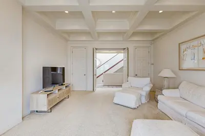 a living room with a couch and a tv at Breakers Way Dream in Carpinteria