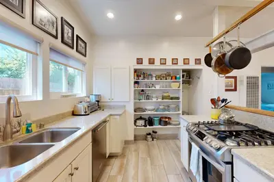 a kitchen with a sink and a stove at Bangor Lane Oasis in Ventura