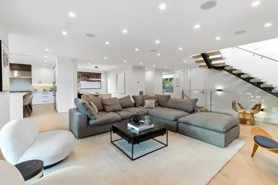 a living room with a couch and a table at Curson Modern in Los Angeles